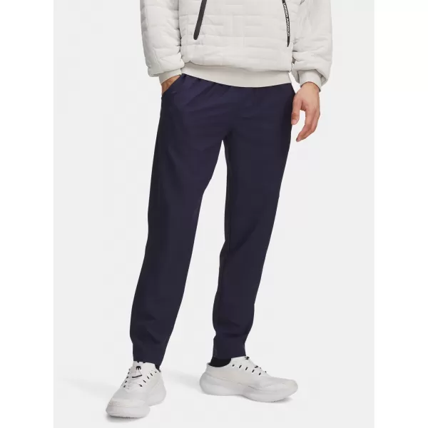  Pánské sportovní kalhoty UNDER ARMOUR UA UNSTOPPABLE TAPERED PANTS 6003861-410 MODRÁ 