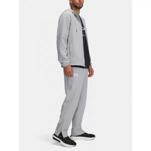  Pánské sportovní kalhoty UNDER ARMOUR UA RIVAL WVN WINDBREAKER PN 1390150-011 ŠEDÁ 
