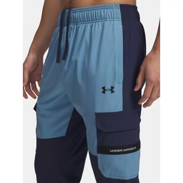  Pánské sportovní kalhoty UNDER ARMOUR UA TECH UTILITY WOVEN PANT 6004966-403 MODRÁ 