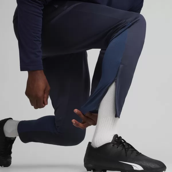  Pánské kalhoty PUMA TEAMGOAL TRAINING PANT 658639_06 PUMA NAVY/WHITE/PERSIAN BLUE 