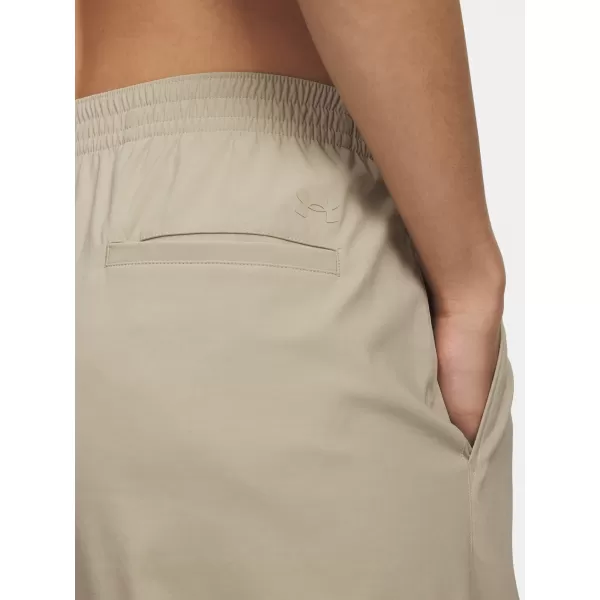  Dámské sportovní kalhoty UNDER ARMOUR UA UNSTOPPABLE WVN PLEAT PT 6007027-299 HNĚDÁ 