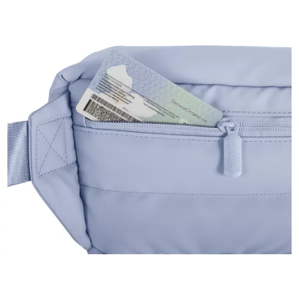  Ledvinka HEYS PUFFER MINI WAIST BAG LIGHT BLUE 