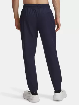 Pánské sportovní kalhoty UNDER ARMOUR UA UNSTOPPABLE TAPERED PANTS 6003861-410 MODRÁ