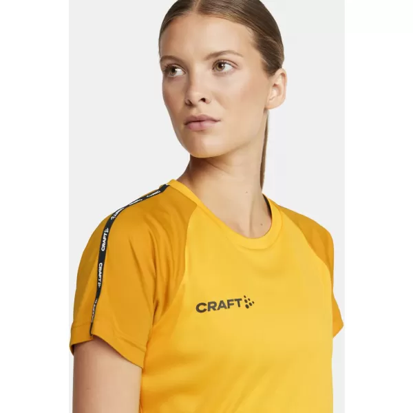  Dámské kontrastní sportovní tričko CRAFT TW Squad Go Contrast Jersey W ŠVÉDSKÁ ŽLUTÁ/ZLATÁ 