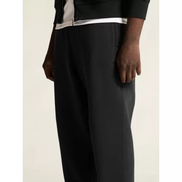  Pánské těžké tepláky CRAFT Corp. Frequent Sweatpants M ČERNÁ 