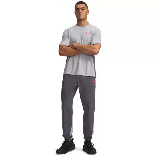  Pánské sportovní kalhoty UNDER ARMOUR UA TECH UTILITY WOVEN PANT 6013802-025 ŠEDÁ 