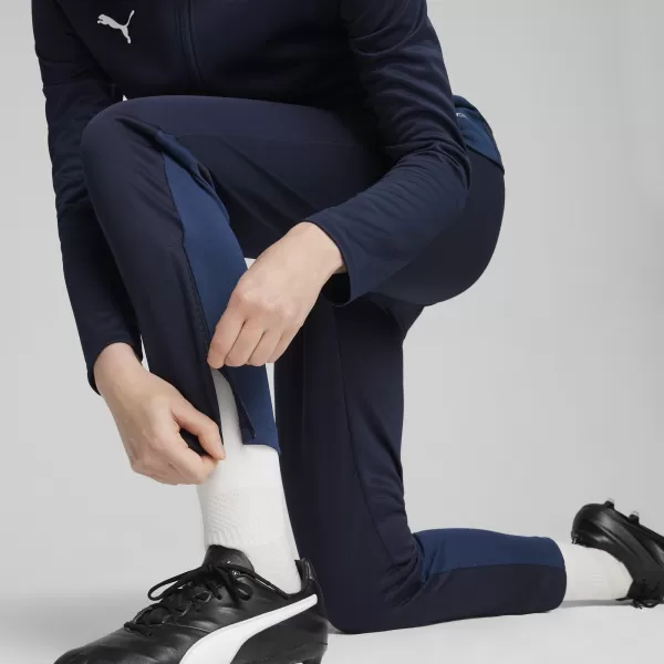  Dámské tepláky PUMA TEAMGOAL TRAINING PANT WMN 658642-06 PUMA NAVY/WHITE/PERSIAN BLUE 