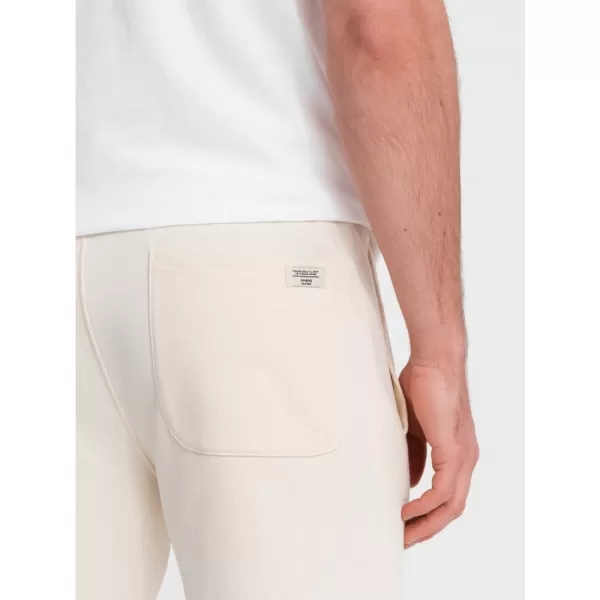  Pánské tepláky OMBRE OM-PABS-0206 CREAM 