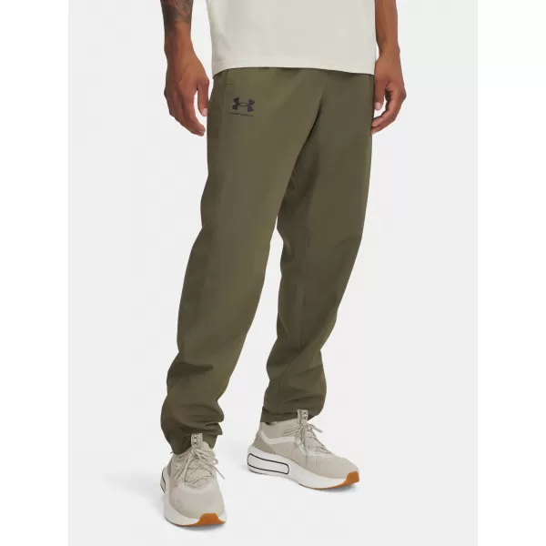  Pánské sportovní kalhoty UNDER ARMOUR RIVAL WVN WINDBREAKER PN 1390150-390 ZELENÁ 