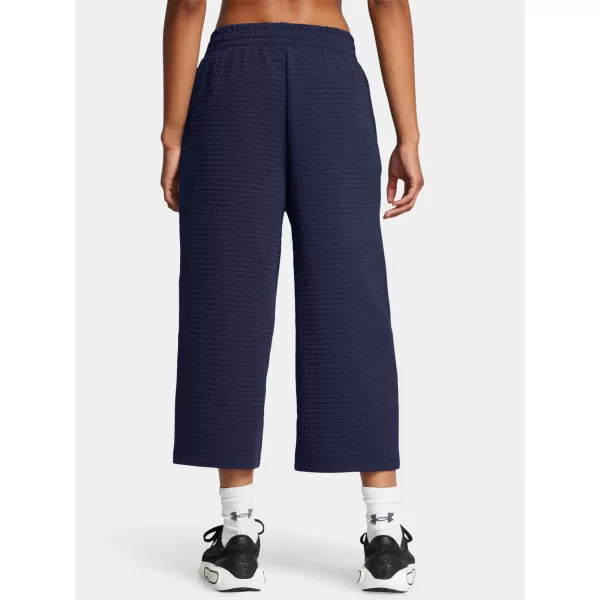  Dámské sportovní kalhoty UNDER ARMOUR UNSTOPPABLE FLC GRID CROP 1386492-410 MODRÁ 