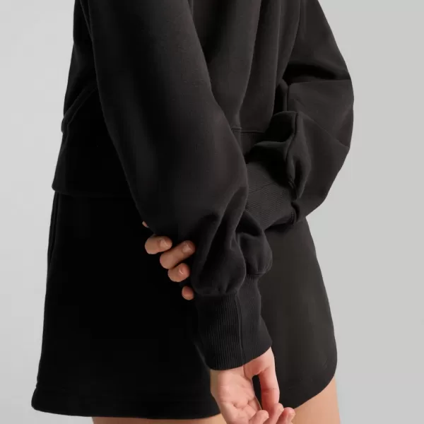  Dámská mikina PUMA WARDROBE ESS RELAXED CROPPED HOODIE TR 629746-01 ČERNÁ 